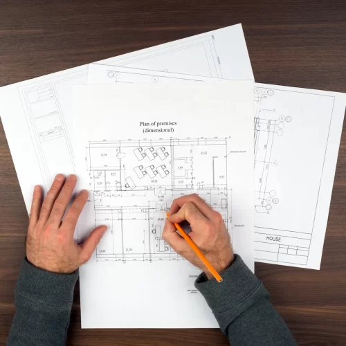 mans-hands-drawing-drafts-on-wooden-table-2025-10-16-13-44-39-utc.webp